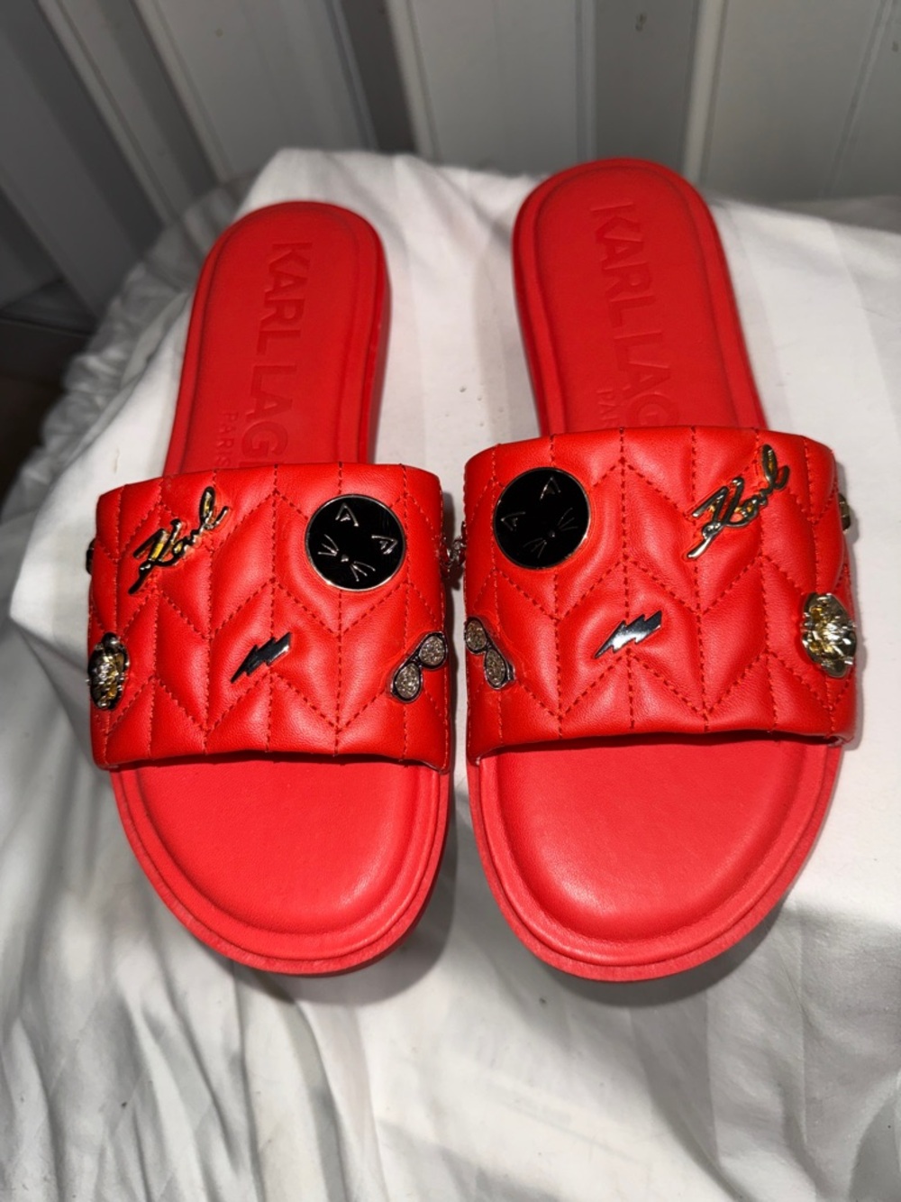 NWOT - Karl Lagerfeld Red Quilted Slide Sandals with Charm Accents. Size: 8.5